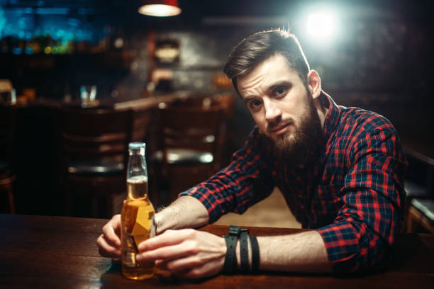 istock Man sitting at the bar counter, alcohol addiction 927168746