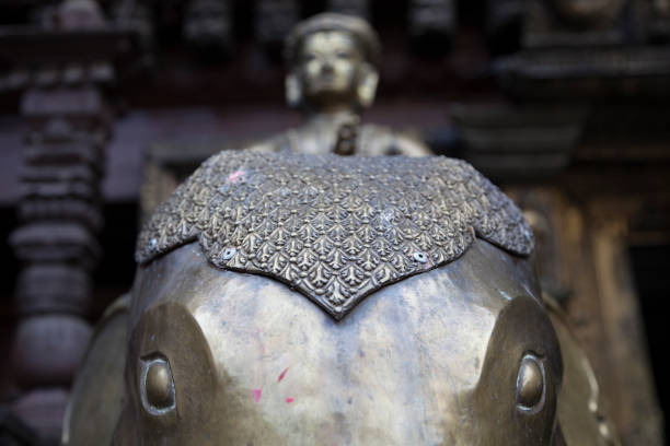A golden buddha on an elephant statue at a monastery in Nepal.