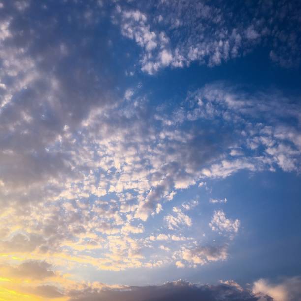istock Deep blue sunny sky with white clouds. Blue sky with cloud close-up. White fluffy clouds in the blue sky. 927173414