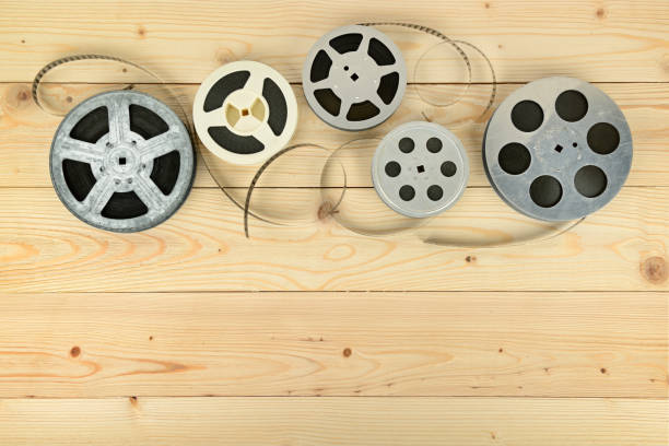 istock Obsolete cinema films on wooden surface 927177876
