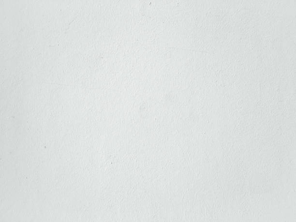 istock Grungy painted wall texture as background. Cracked concrete vintage wall background, old white painted wall. Background washed painting. 927178712