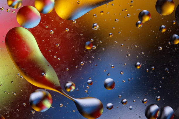 istock Abstract image with colorful circles and shapeless bodies on a colored background. 927185184