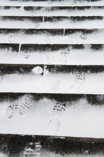 istock Winter stone ledder with snow shoes prints 927185232