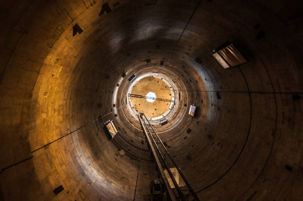 istock Interior view of the industrial pipe with daylight in the end 927190778