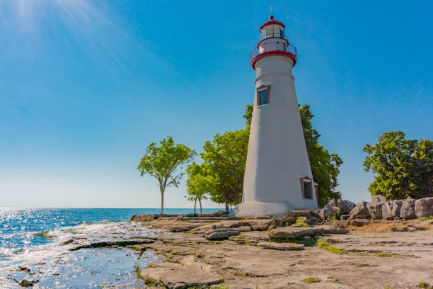 Marblehead lighthouse State Park, Ohio (P) adventure getaway; family outing; historic structure;  fantastic colors, lighthouse and ocean, lighthouse with sunrays lake erie stock pictures, royalty-free photos & images