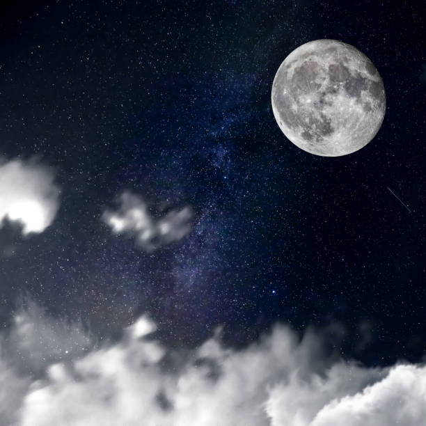 istock Night sky, clouds, moon and stars 927193586