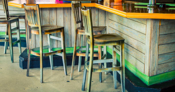 istock wooden chairs at a bar 927193670