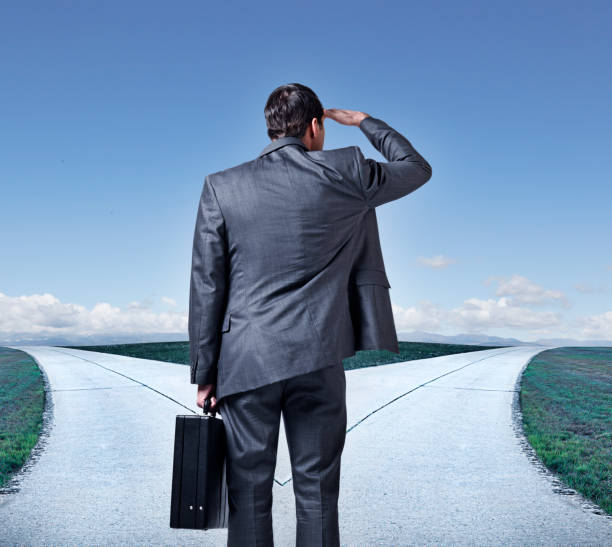 istock Businessman At Fork In The Road 927194372