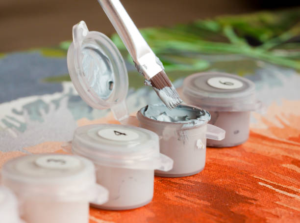 istock Brush and paint containers for painting by numbers 927204828