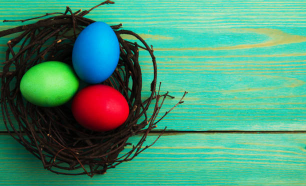 istock Easter eggs on a wooden background .Easter eggs of different colors .Easter eggs top view 927207616
