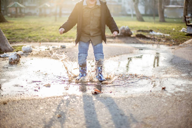 istock Jumping in the puddles 927214386