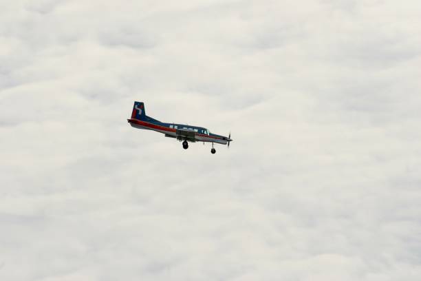 istock Low Angle View Of Airplane Flying Against Cloudy Sky 927215414