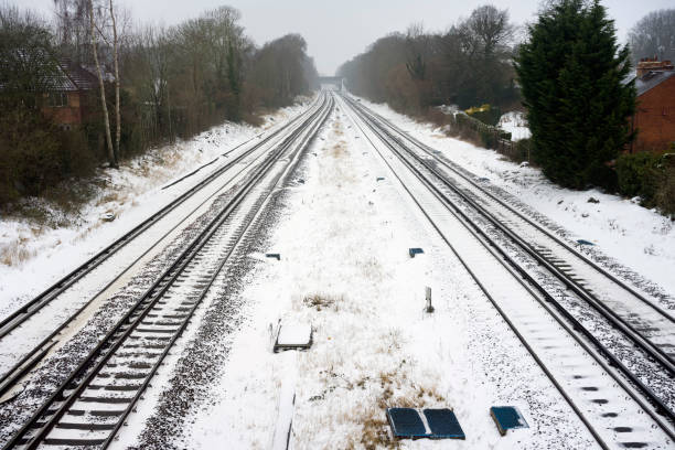 istock The south western mainline at Hook in Hampshire on a winter's day 927215800