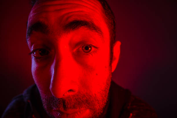 istock Man with suspicious facial expression 927219928
