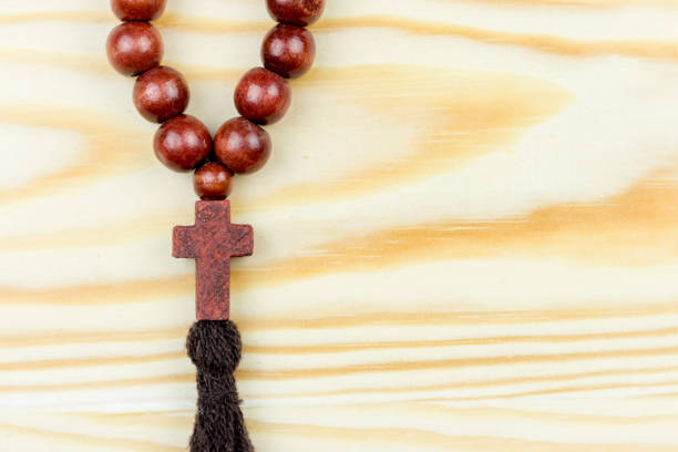 istock Cross on wooden background 927225752