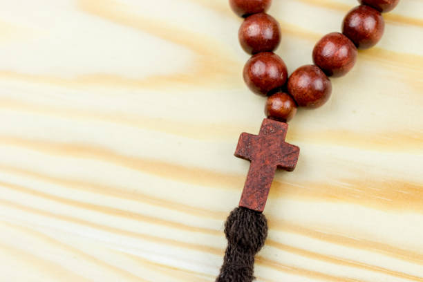 istock Cross on wooden background 927225812