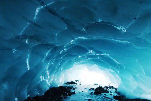 Natural ice cave in mountain, hiking and adventure