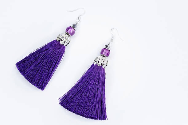 istock Purple handmade earrings on white 927229822