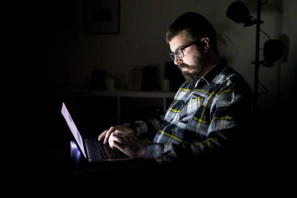 istock Bearded man at home working on laptop 927237834