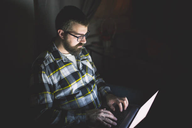 istock Bearded man at home working on laptop 927237866
