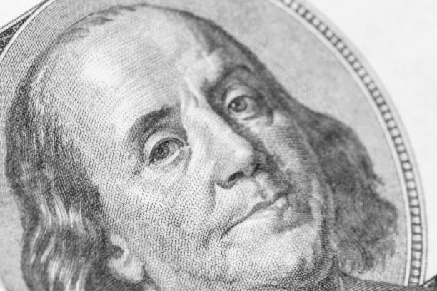 istock Benjamin Franklin portrait close-up on 100 dollars banknote 927241178