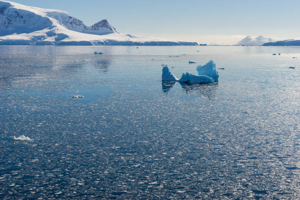 istock Antarctic Landscape with Icebergs and Mountains 927244474