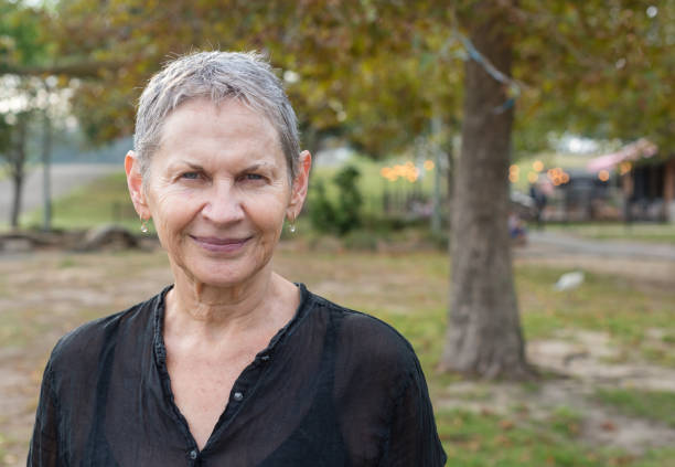 istock Beautiful older woman in park 927244494