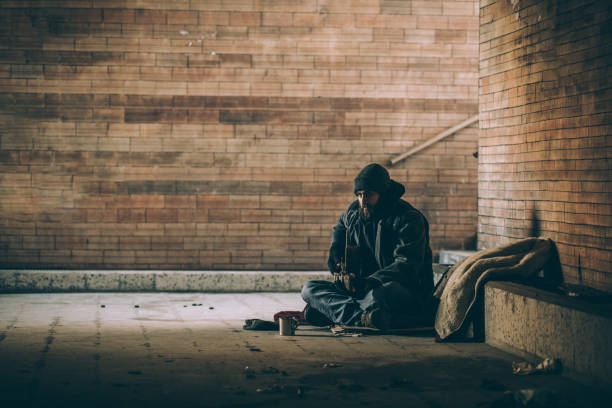 istock Homeless musician in underpass 927253180