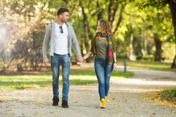 istock Happy couple walking and embracing 927253266