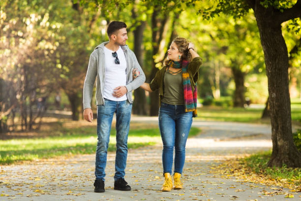 istock Happy couple walking and embracing 927253274