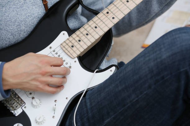 istock Male hands at home play and tun 927253438