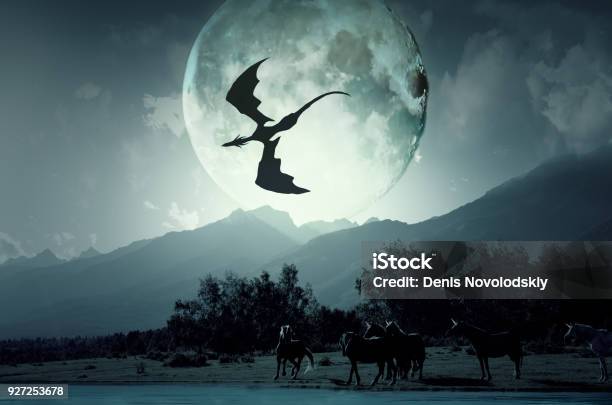 The Dragon Flies Over The Unicorns Stock Photo - Download Image Now - Dragon, Fantasy, Forest
