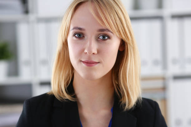 istock Beautiful smiling girl at workplace look in camera 927253864