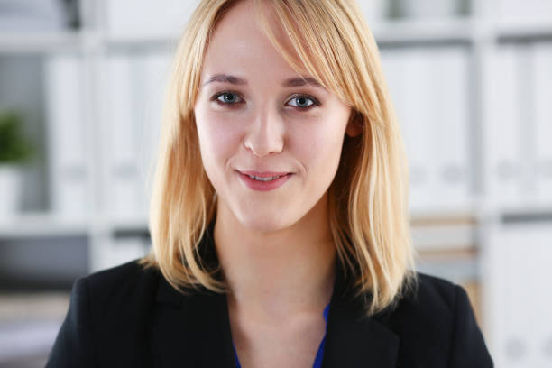 istock Beautiful smiling girl at workplace look in camera 927253868