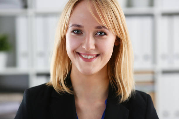 istock Beautiful smiling girl at workplace look in camera 927253874
