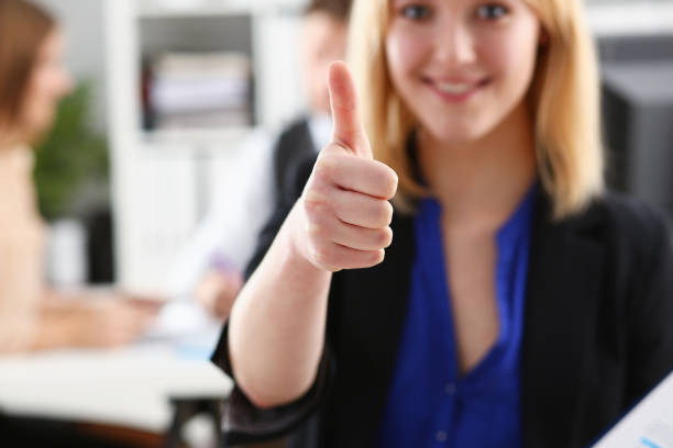 istock Beautiful smiling woman showing OK 927255990