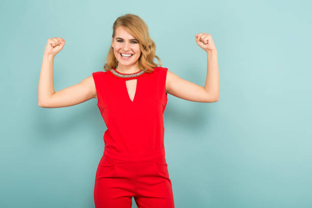 istock Attractive woman shows muscles 927256370
