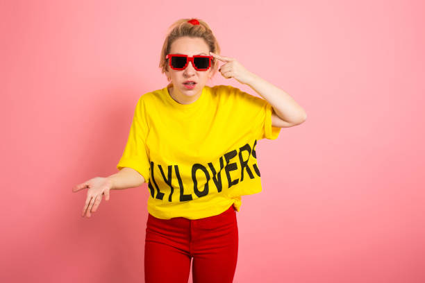 istock Blonde woman in bright clothes 927256530