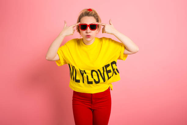 istock Blonde woman in bright clothes 927256546