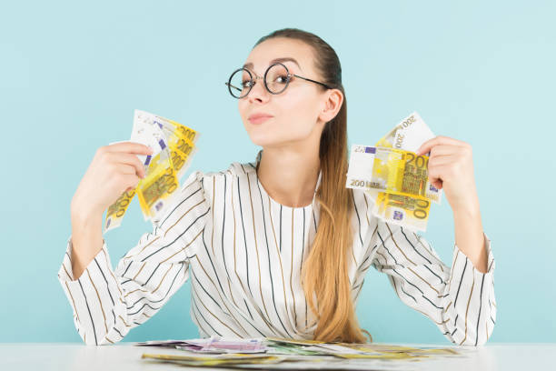 istock Attractive woman with cash 927256620