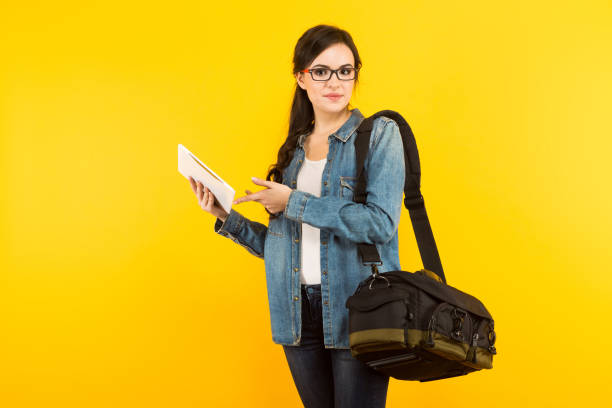 istock Young woman with bag and pc 927256638