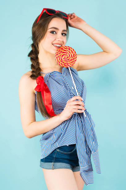 istock Young sexy woman with lollipop 927256850