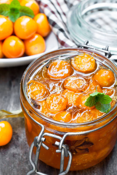 istock Homemade  physalis jam in jar on wooden table 927258046