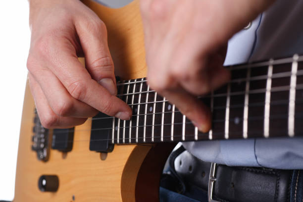 istock Male arms playing classic shape electric guitar 927258190