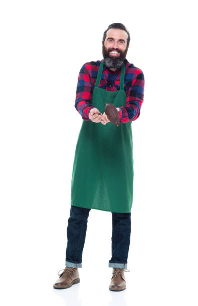 istock Male artisan holding cocoa seed for chocolate making 927258466