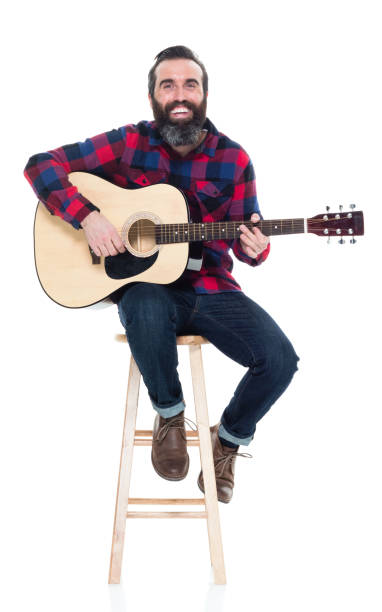 istock Handsome singer songwriter sitting on stool 927264226
