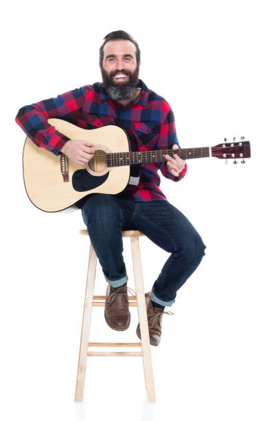 istock Handsome singer songwriter sitting on stool 927264332