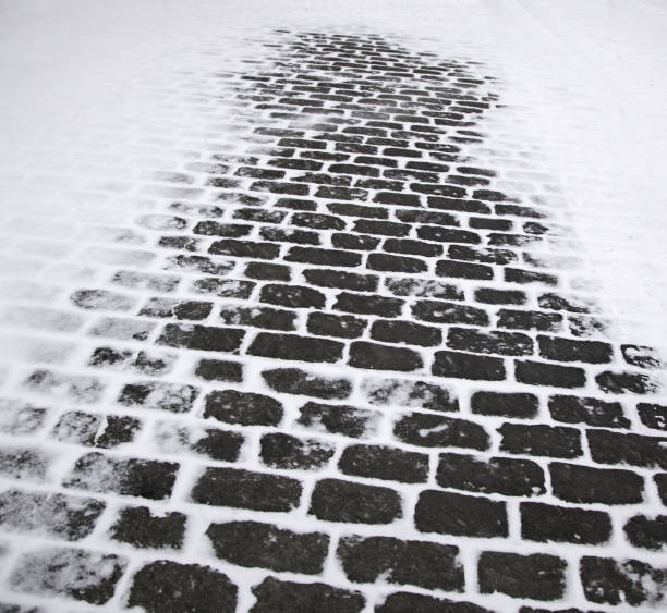 Snowy urban street floor with ice, winter and danger