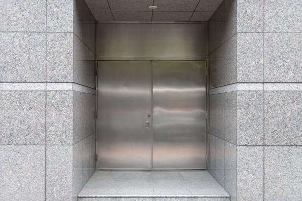 istock sidewalk by street wall & door 927268494