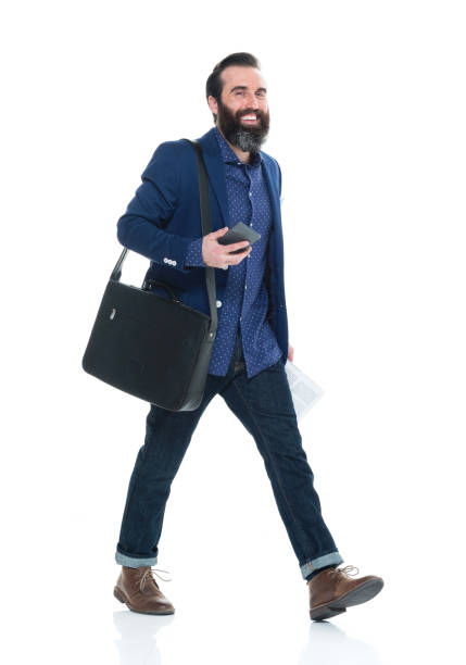 Man with beard holding bag and phone
